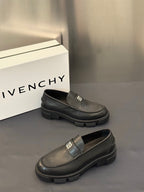 Two dark leather loafers with square logo buckle strap and ridged platform sole