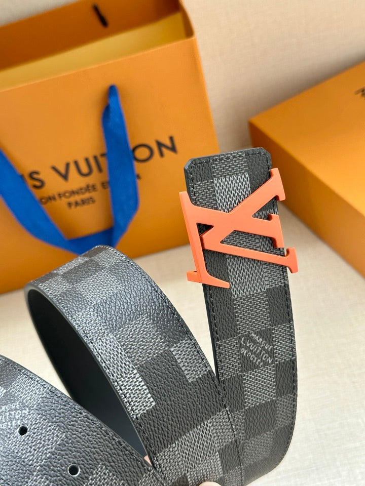 Louis Vuitton checkered belt strap with orange LV buckle and metal holes