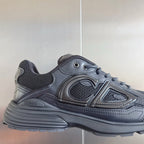 Dior unisex sneakers dark gray, close side view with molded logo and lace holes