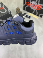 Versace blue lace-up sneaker side view, thick tread and lace panels