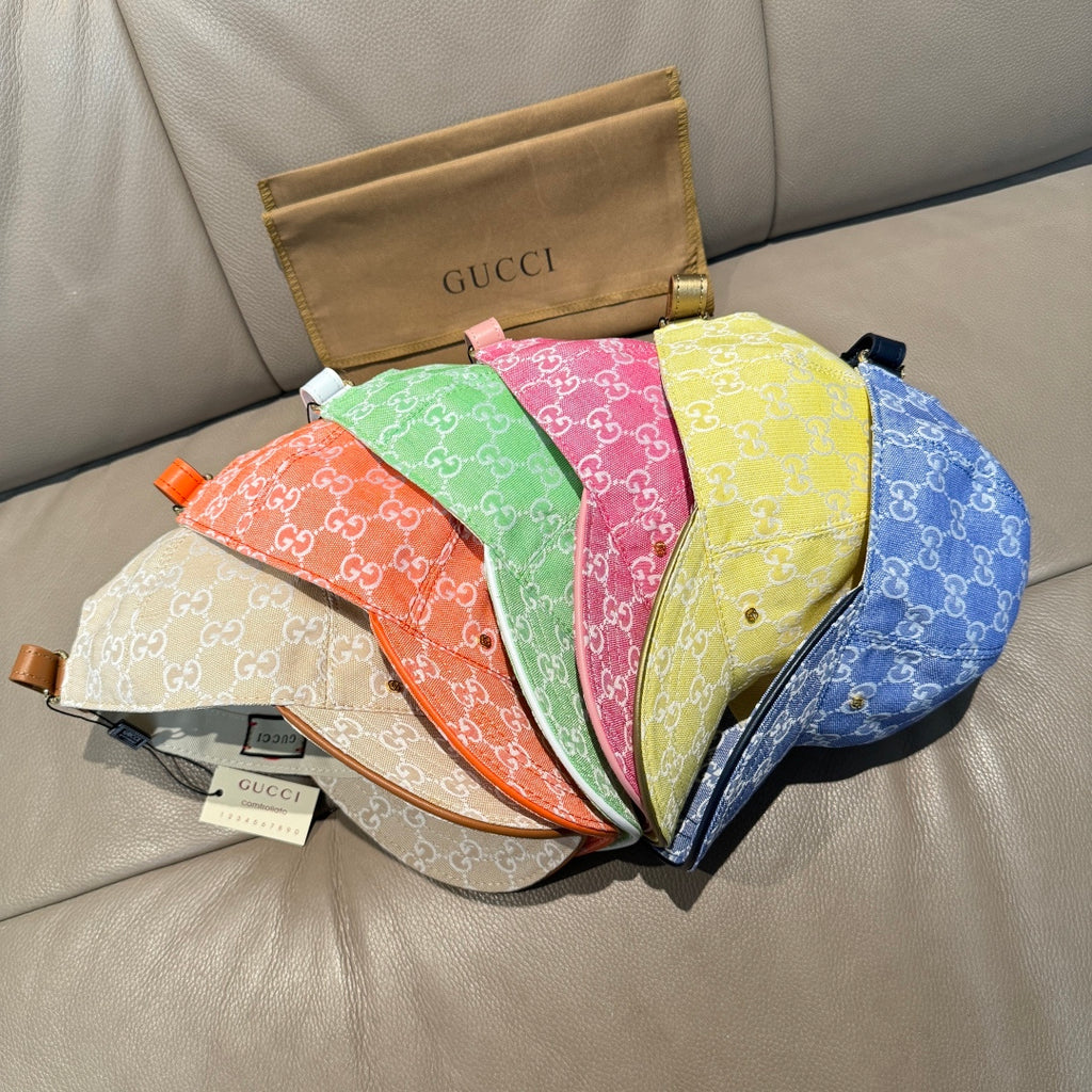 Assorted Gucci caps with multicolor GG monogram fabric, curved brims and straps.