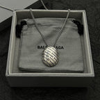 Silver-tone chain necklace with logo pendant in open gift box