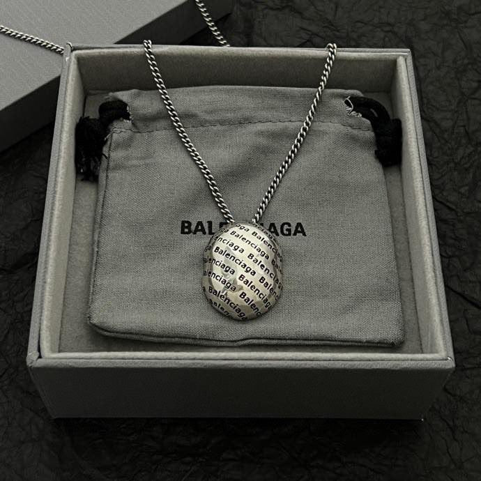 Silver-tone chain necklace with logo pendant in open gift box