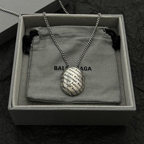 Silver-tone chain necklace with logo pendant in open gift box