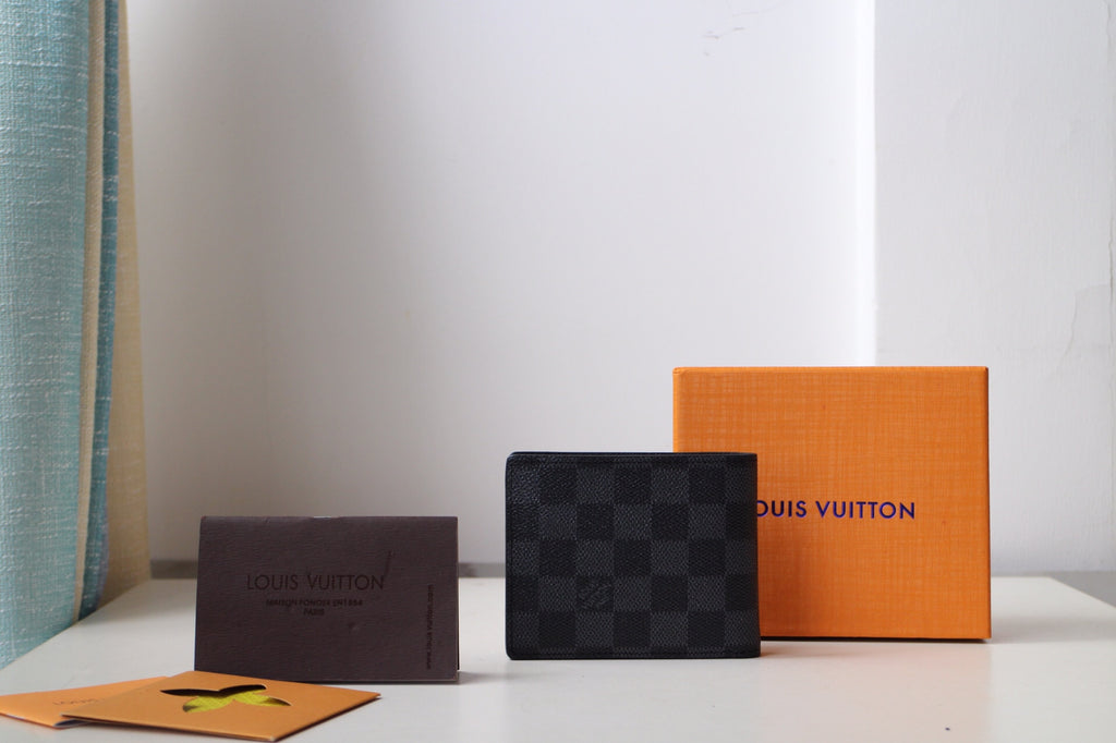 Dark checkered Louis Vuitton wallet with square front panel