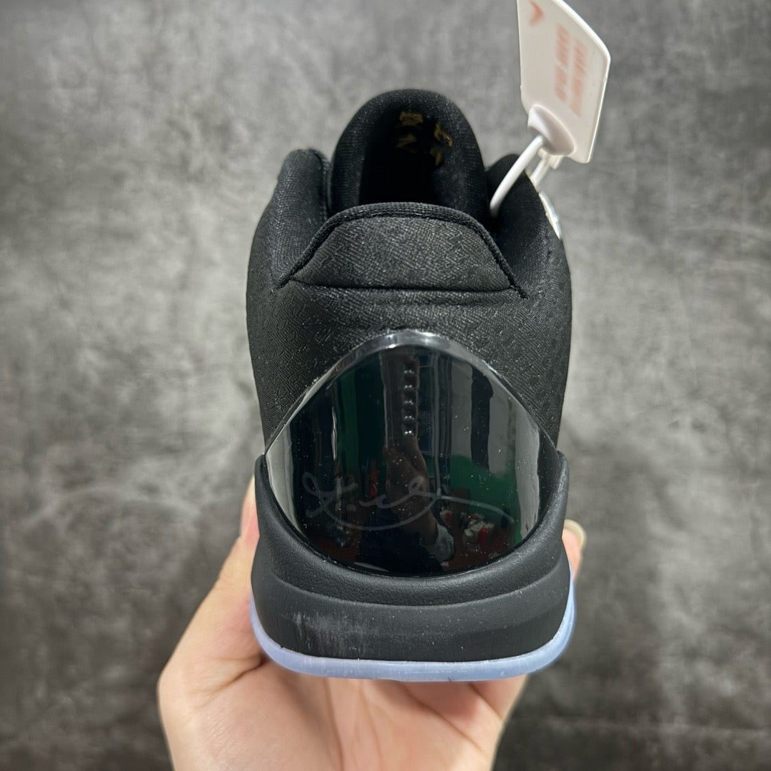 Basketball sneaker heel with dark outsole and translucent heel panel, black upper