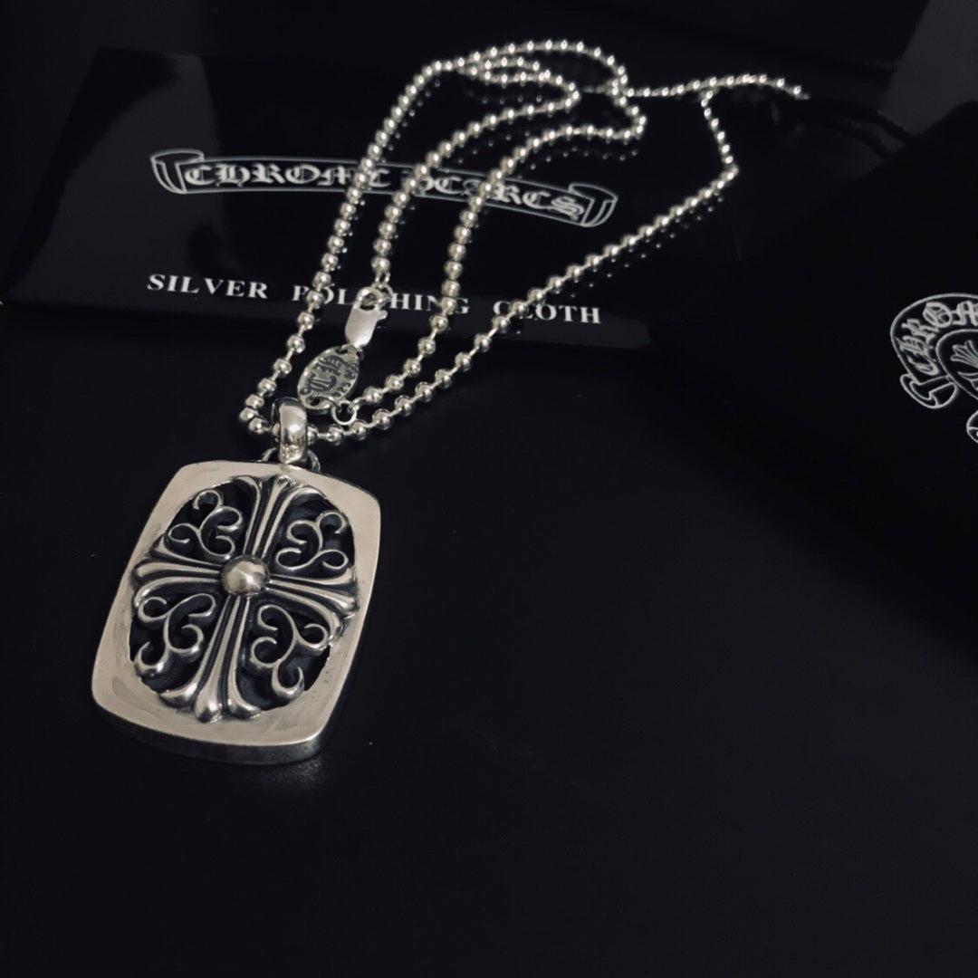 Silver square pendant necklace with filigree scroll design and bead chain
