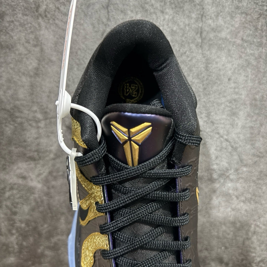 Basketball sneaker tongue and laces in dark purple with gold emblem, black upper