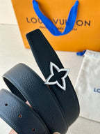 Star emblem buckle on navy pebbled leather belt with punched hole tabs