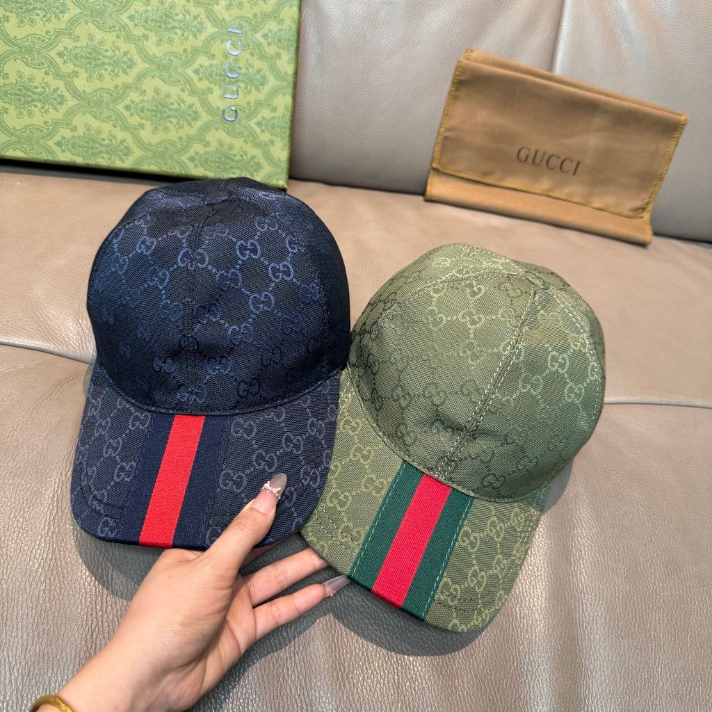 Pair of GG canvas caps: one dark blue with Web stripe, one dark green with Web stripe