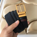 Prada belt with gold buckle, dark textured strap, and prong centered.