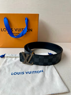 Checkered leather belt with silver-toned LV buckle and stud holes