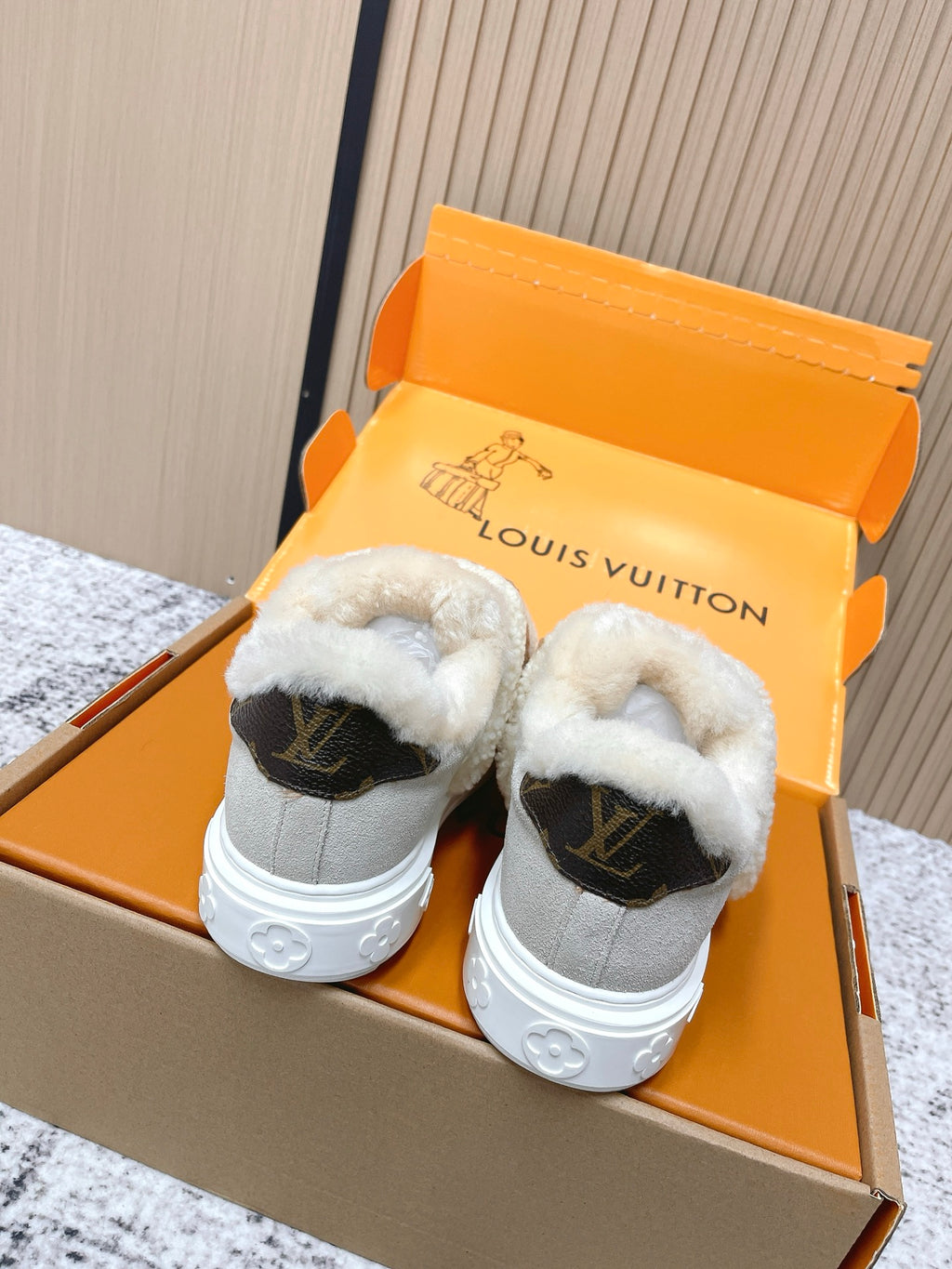 Shearling slip-on sneakers, gray uppers with white sole and black logo heel panels