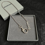 Balenciaga chain necklace with silver ring and logo charm in gift box