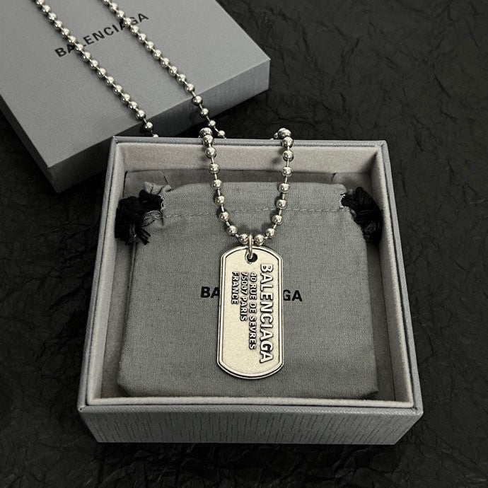 Beaded dog tag necklace with pendant shown in gift box