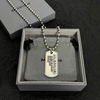 Beaded dog tag necklace with pendant shown in gift box
