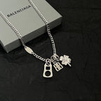 Balenciaga silver pendant necklace with BB, keyhole, and clover charms