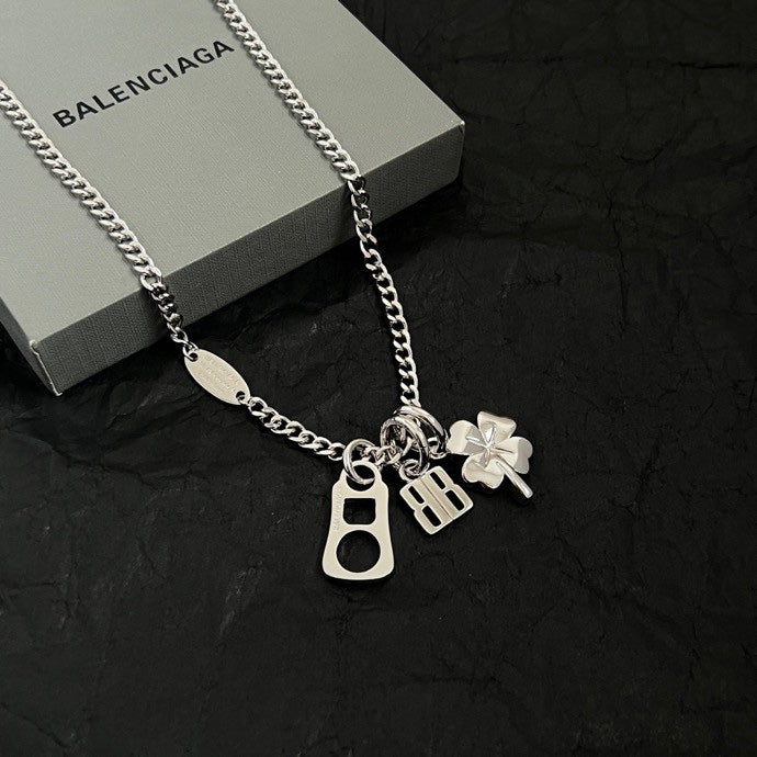 Balenciaga silver pendant necklace with BB, keyhole, and clover charms