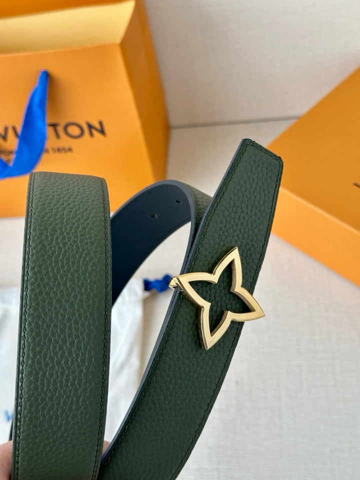 Green leather belt with large star buckle and perforation holes