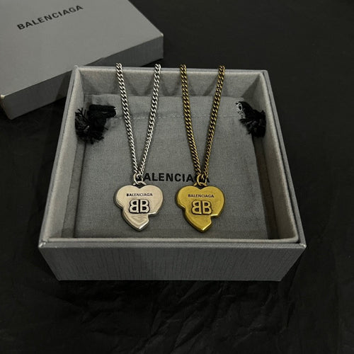 Heart pendant necklace set with silver and gold-tone heart charms in gift box