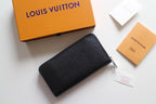 Louis Vuitton small black textured leather zip bag with metal zipper pull
