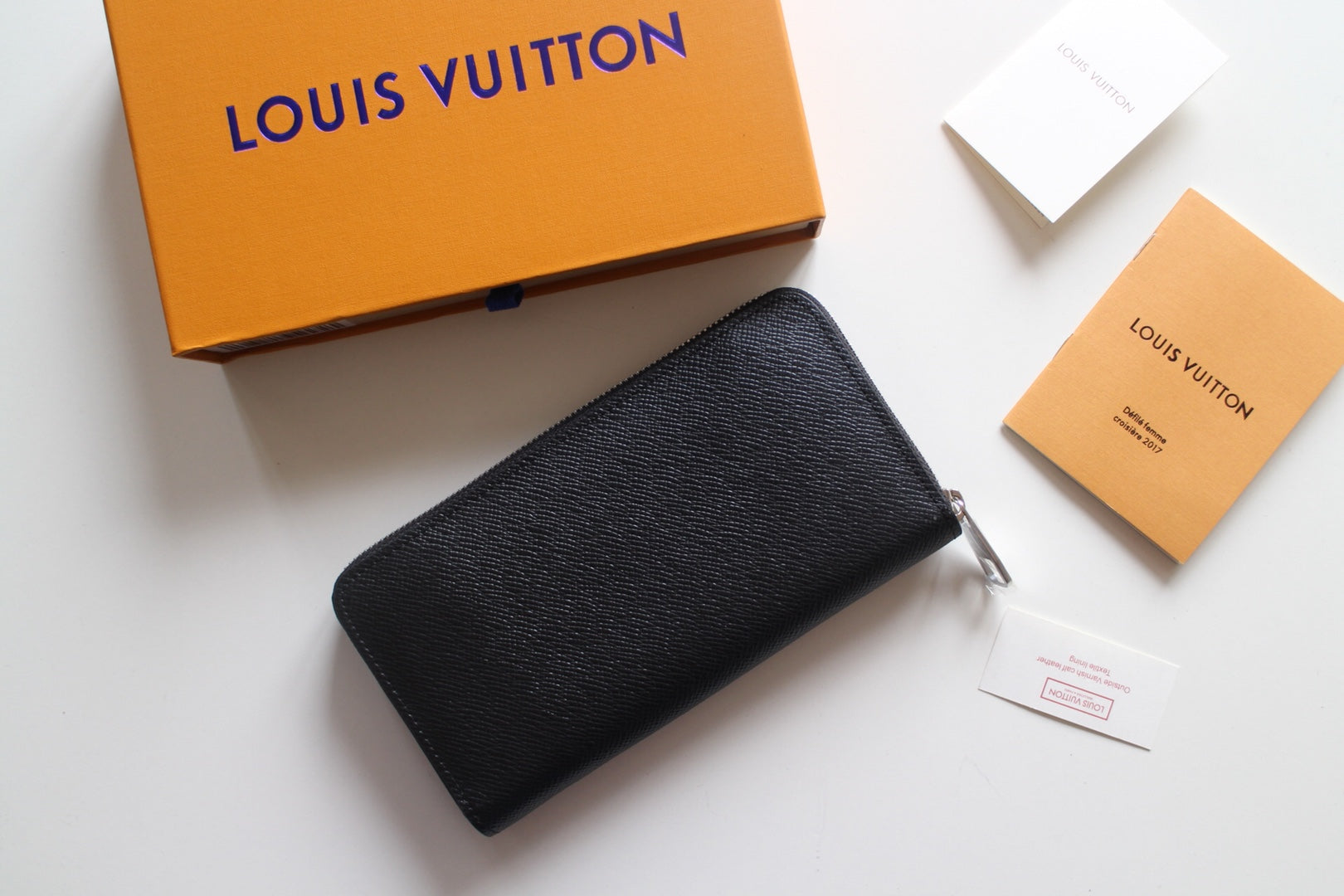 Louis Vuitton small black textured leather zip bag with metal zipper pull
