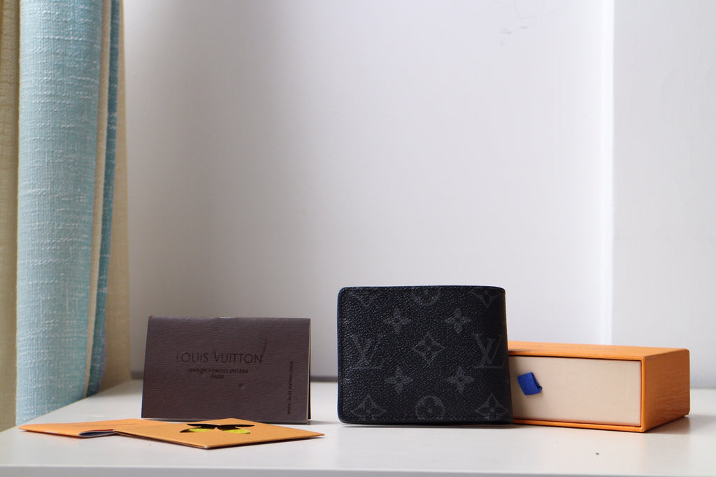 Louis Vuitton small bag, black monogram leather pouch with front flap
