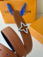 Tan belt with textured finish and silver star buckle with dark navy outline