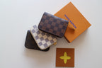 Louis Vuitton small crossbody pouches with checkered flap and silver hardware