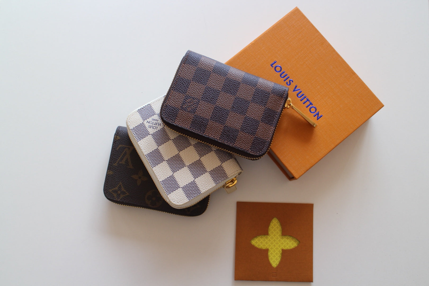 Louis Vuitton small crossbody pouches with checkered flap and silver hardware
