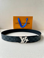 Dark leather belt with LV logo buckle, paired with a gift bag and pouch.
