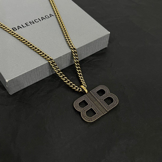 Balenciaga BB logo pendant necklace with gold chain and studded BB charm