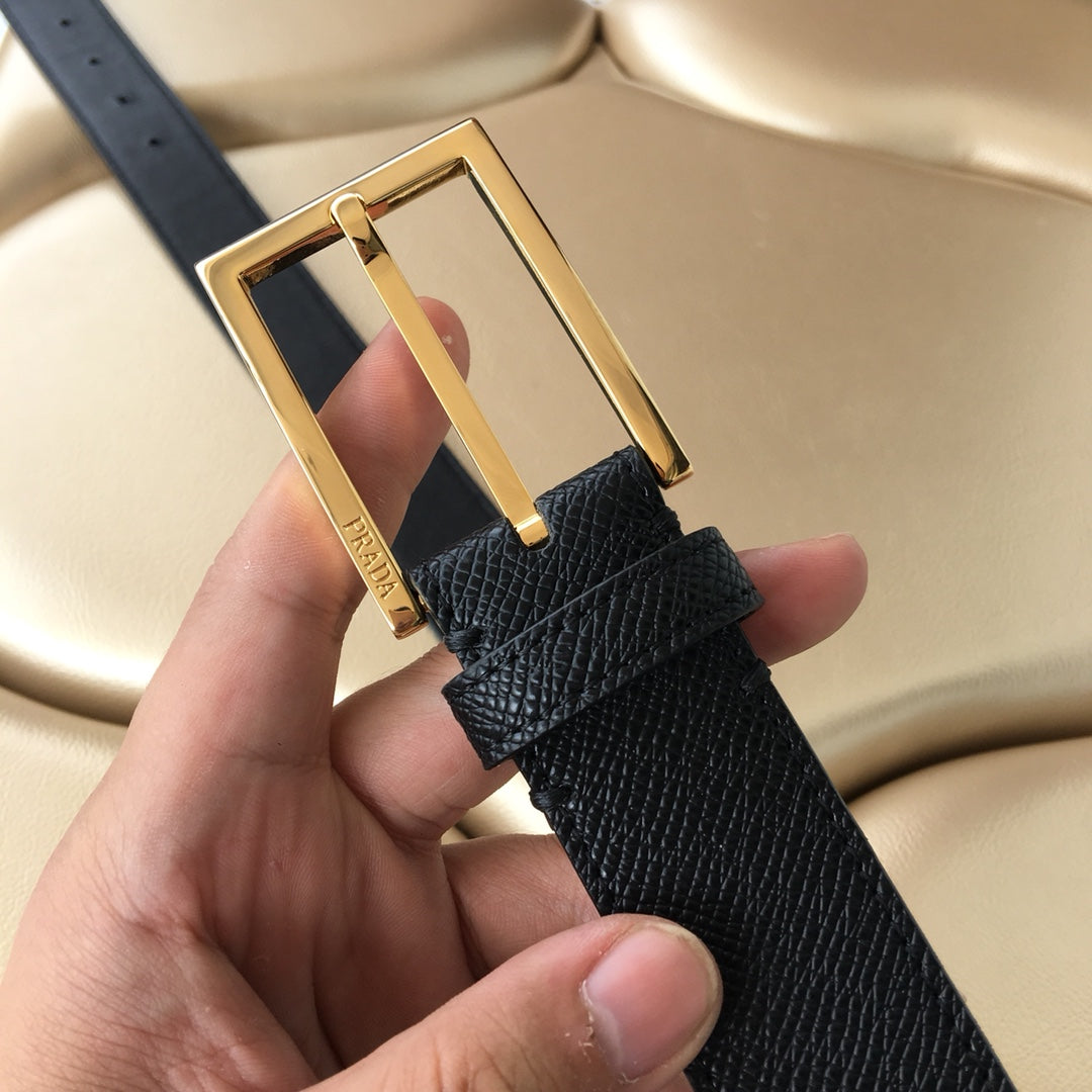 Prada belt with gold-tone buckle featuring a central bar and dark textured leather
