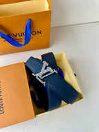 Louis Vuitton leather belt dark blue with gold-tone LV buckle, shown in open packaging