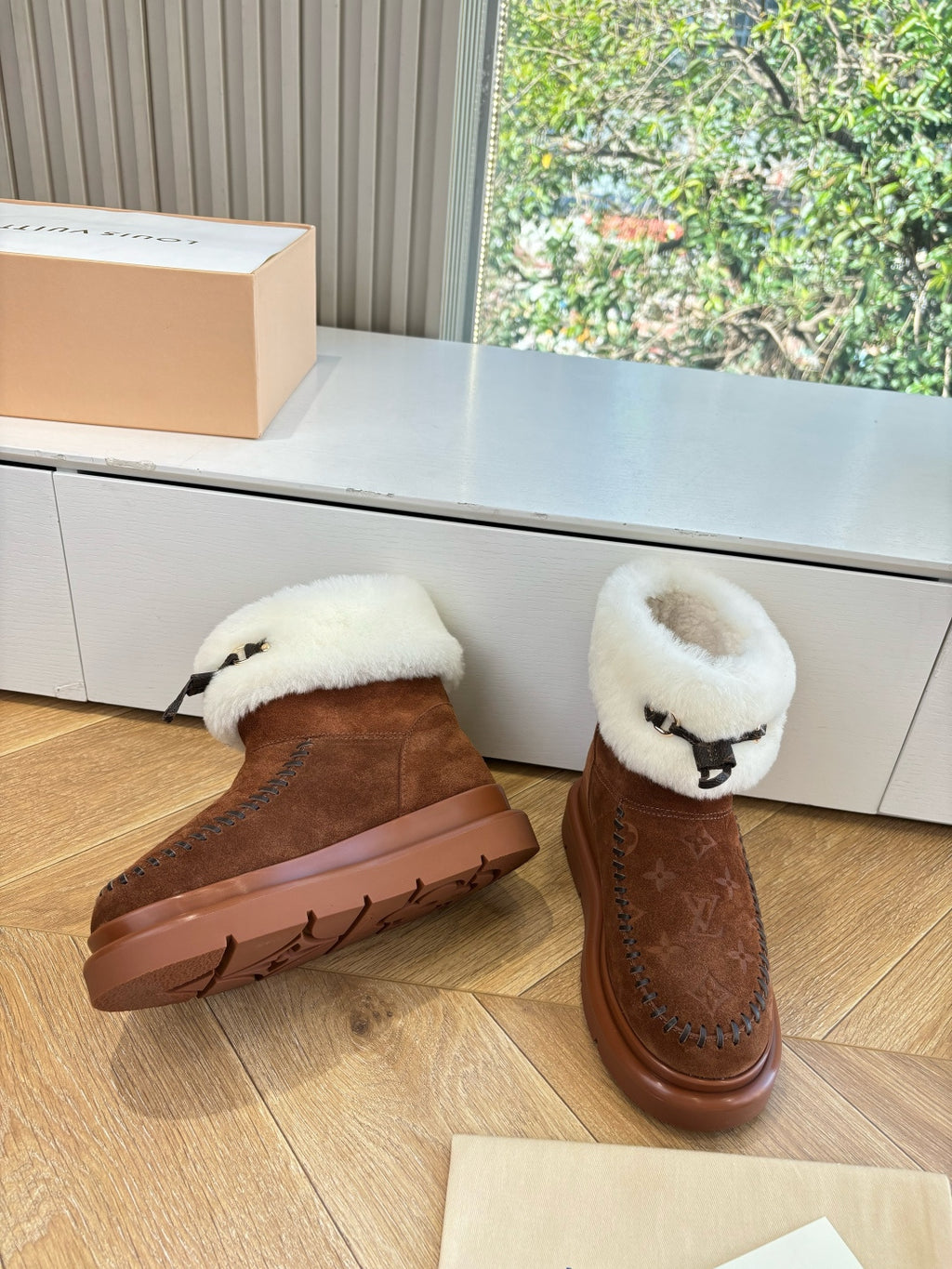Louis Vuitton unisex brown suede boots with cream shearling trim and thick rubber sole