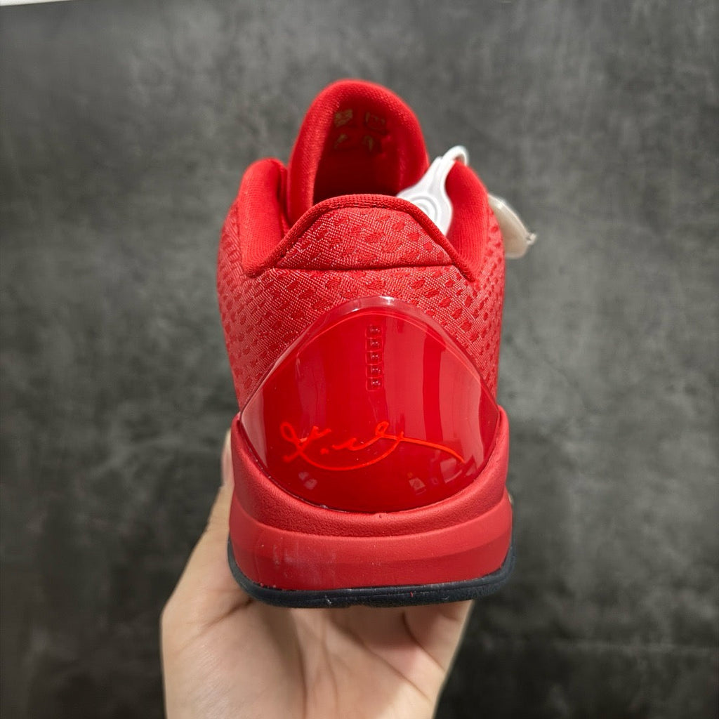Red basketball shoe heel view with molded details and cushioned collar