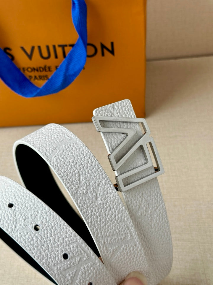 White leather belt with LV buckle and rows of adjustment holes