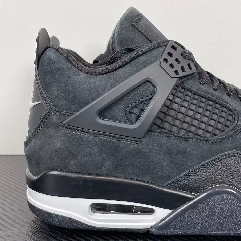 Air Jordan 4 sneakers, dark gray suede with molded side panel, mesh quarter, and lace-up