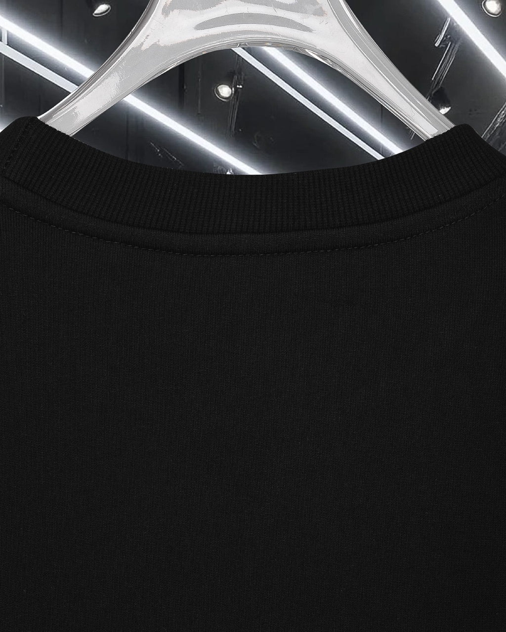 Moncler long-sleeve top in dark color with ribbed crew neckline