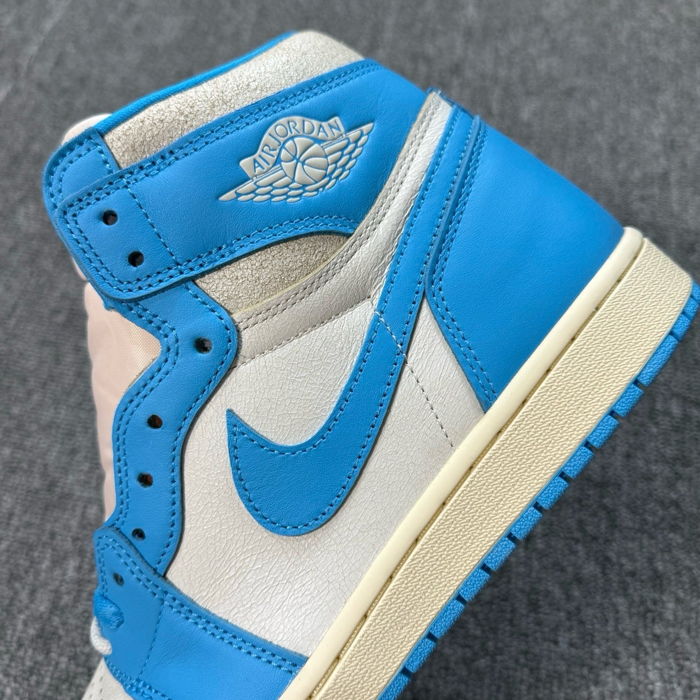Air Jordan 1 Retro High OG sneakers with Wings logo, blue and white upper