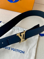 Louis Vuitton leather belt dark blue, gold-tone LV buckle close-up on front