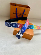 Logo-print belt with multicolor motifs and silver buckle, folded and displayed
