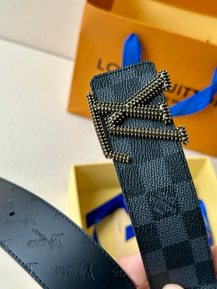 Leather belt with silver-toned LV buckle detail and dark checkered pattern