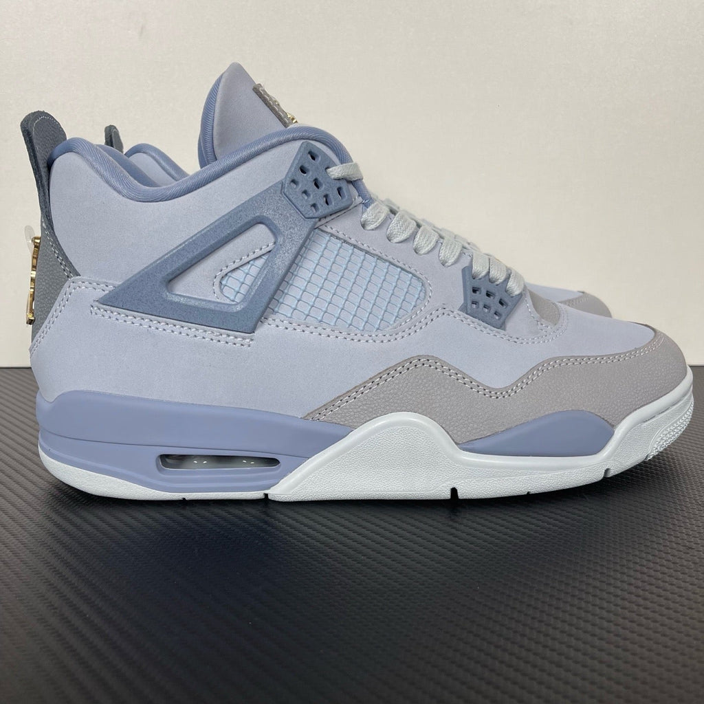 Light blue Air Jordan 4 sneaker with mesh panel and gray quarter overlays