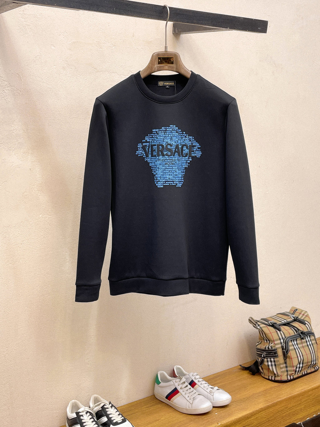 Navy Versace sweatshirt with blue mosaic logo on chest