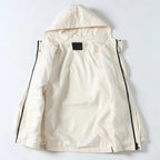 White hooded jacket interior view with button front and black zipper trim