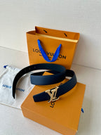 Louis Vuitton leather belt dark blue with gold-tone LV buckle, belt laid flat