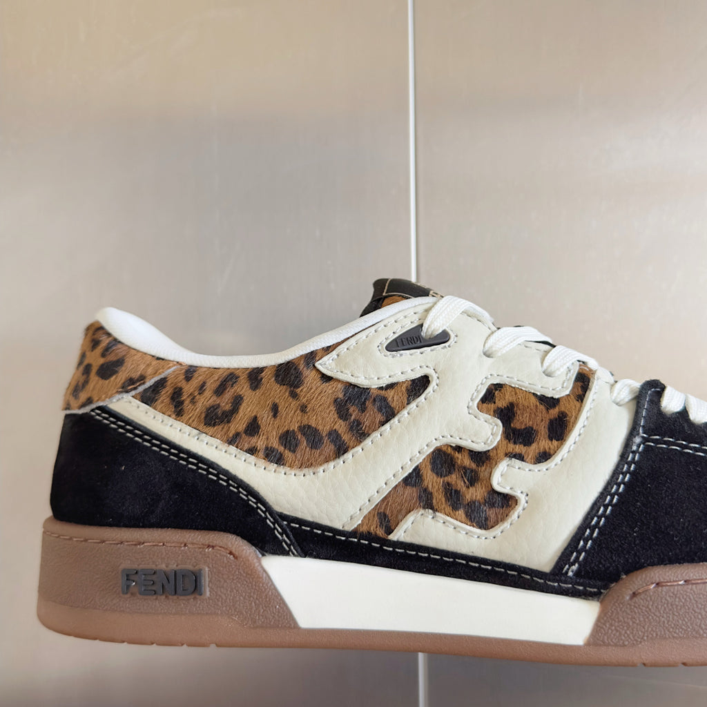 Fendi unisex sneaker close-up: leopard print upper, white side panels, navy accents
