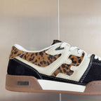 Fendi unisex sneaker close-up: leopard print upper, white side panels, navy accents