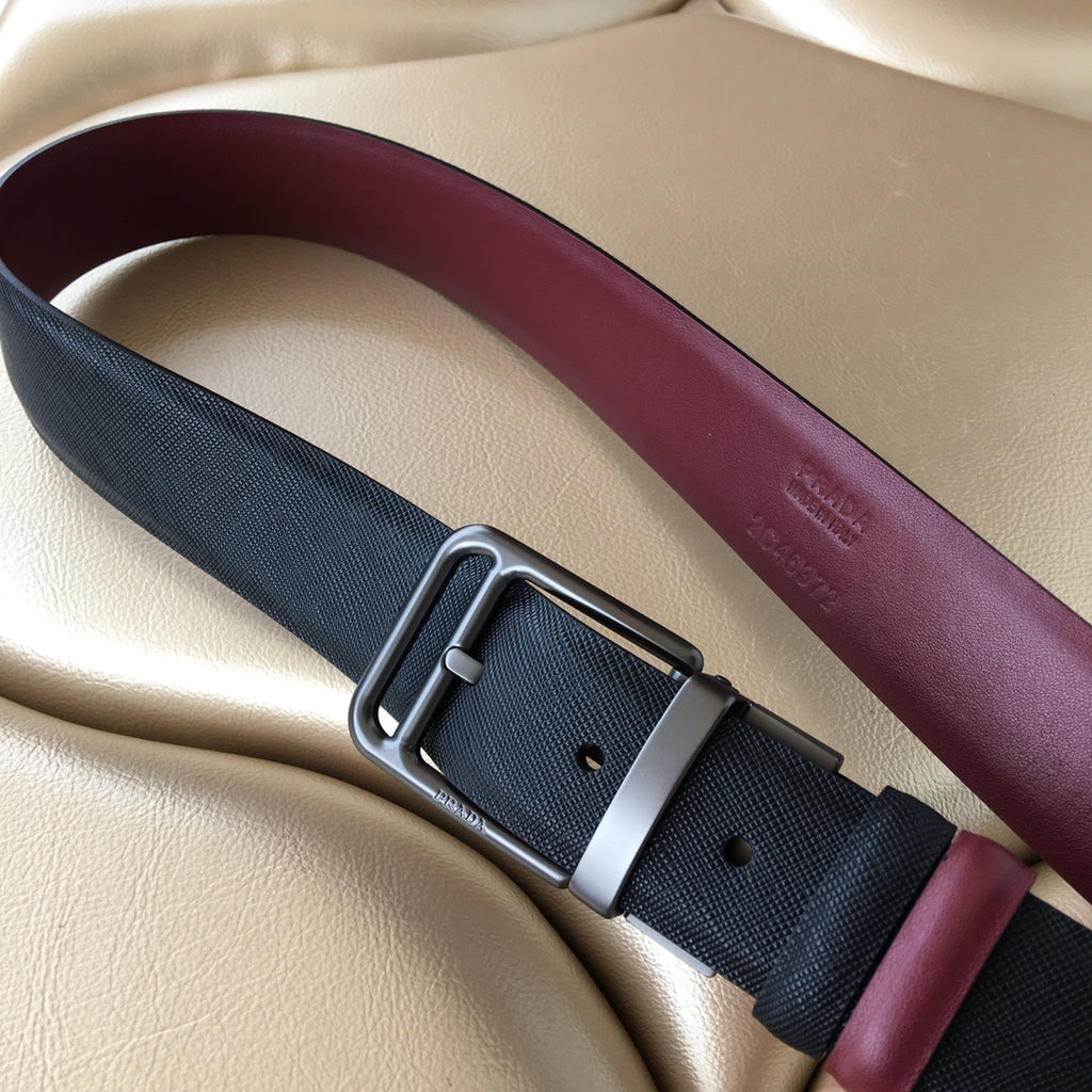 Prada belt with dark blue woven strap, burgundy underside, and silver-tone buckle